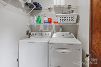 laundry room featuring washer and clothes dryer