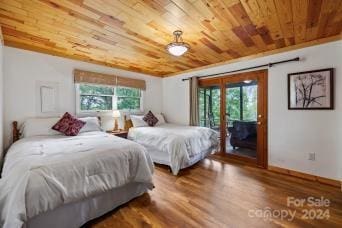 bedroom with wood-type flooring, access to outside, multiple windows, and wooden ceiling