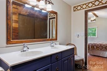 bathroom featuring vanity and an inviting chandelier