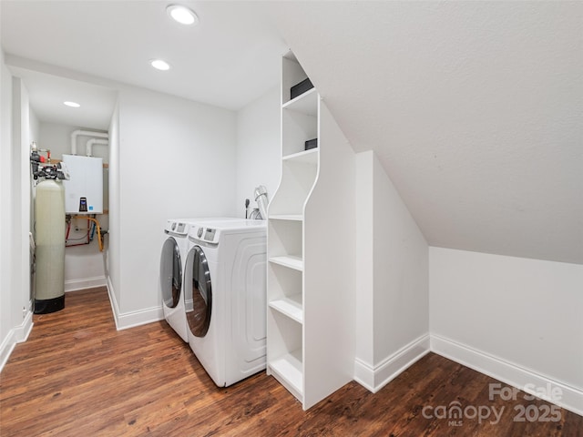 laundry room with washer and clothes dryer and dark hardwood / wood-style floors