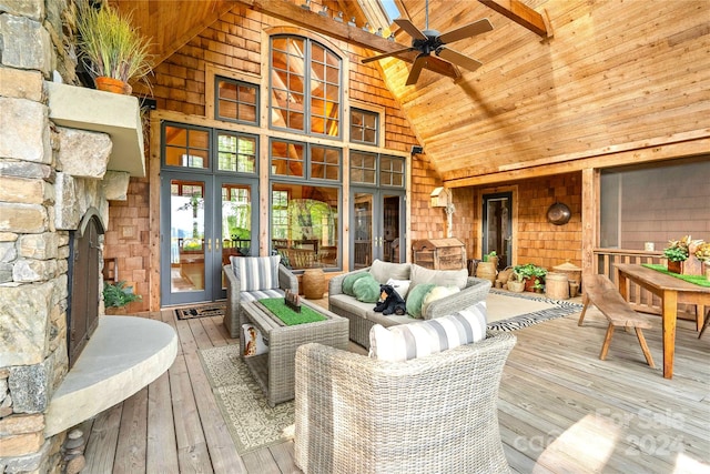 wooden deck with ceiling fan and an outdoor living space