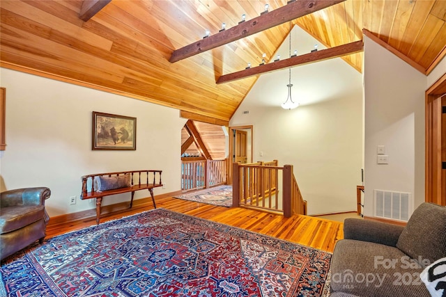 living room featuring lofted ceiling with beams, hardwood / wood-style floors, and wooden ceiling