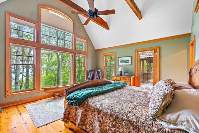 bedroom featuring high vaulted ceiling, ceiling fan, beamed ceiling, and hardwood / wood-style flooring