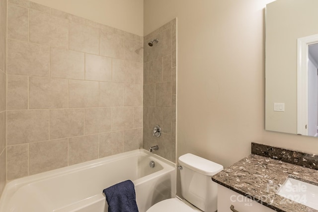 full bathroom with vanity, toilet, and tiled shower / bath