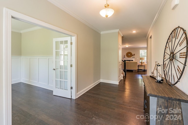 hallway featuring crown molding and dark hardwood / wood-style flooring