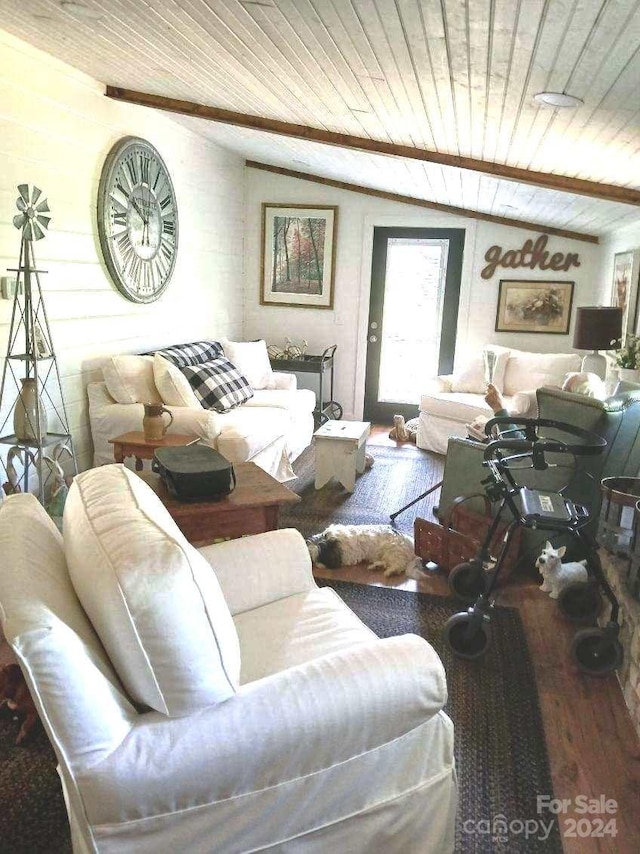 living room with lofted ceiling with beams, hardwood / wood-style floors, and wooden ceiling