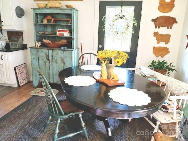 dining room featuring dark wood-type flooring