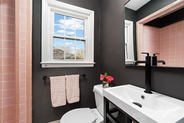 bathroom featuring sink and toilet