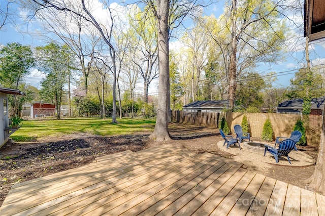 wooden terrace featuring a fire pit