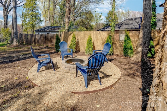 view of yard with a fire pit