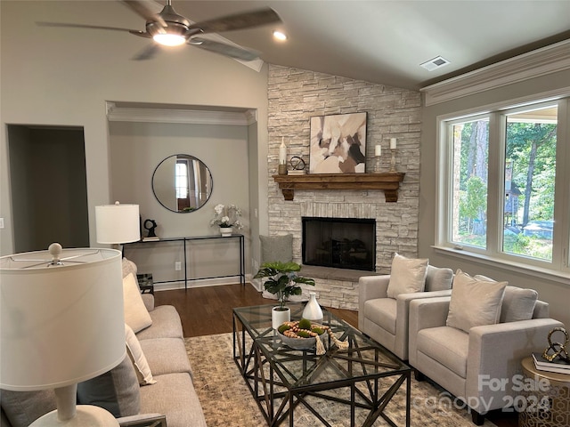 living room with vaulted ceiling, a fireplace, dark hardwood / wood-style floors, and ceiling fan