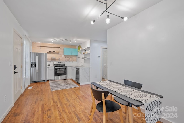 dining room featuring light hardwood / wood-style floors and sink