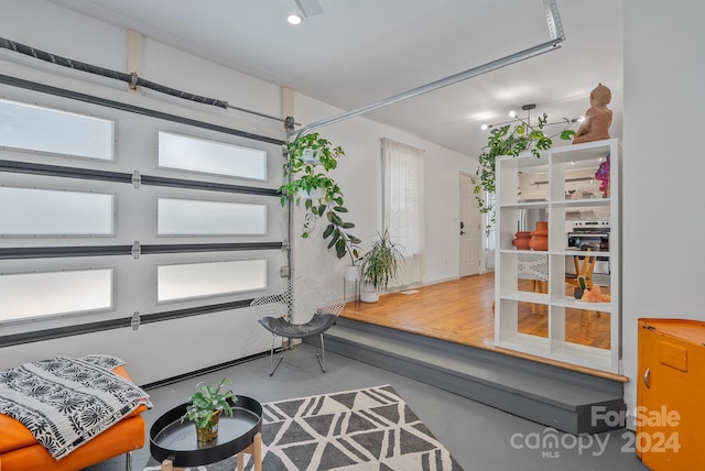 living room with concrete flooring and plenty of natural light