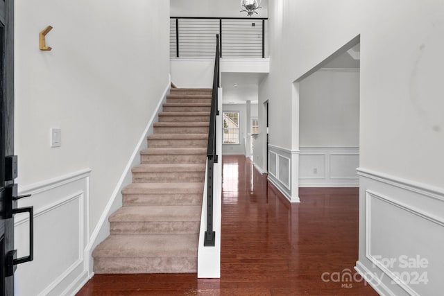 stairway with hardwood / wood-style flooring