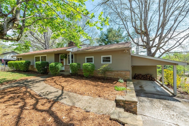 ranch-style home with a carport