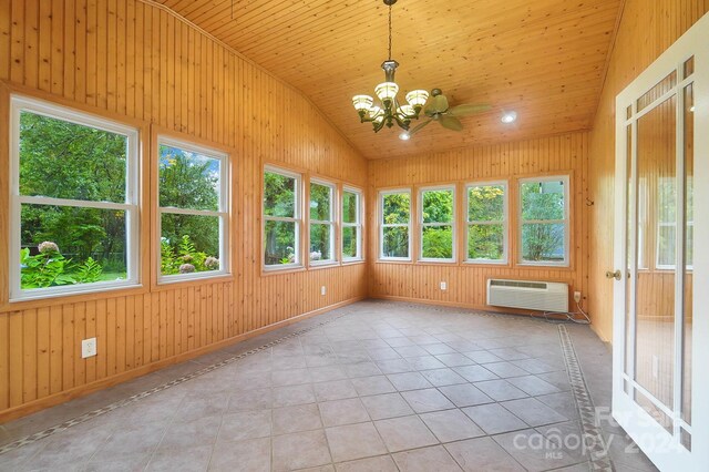 unfurnished sunroom with ceiling fan with notable chandelier, lofted ceiling, wood ceiling, and an AC wall unit