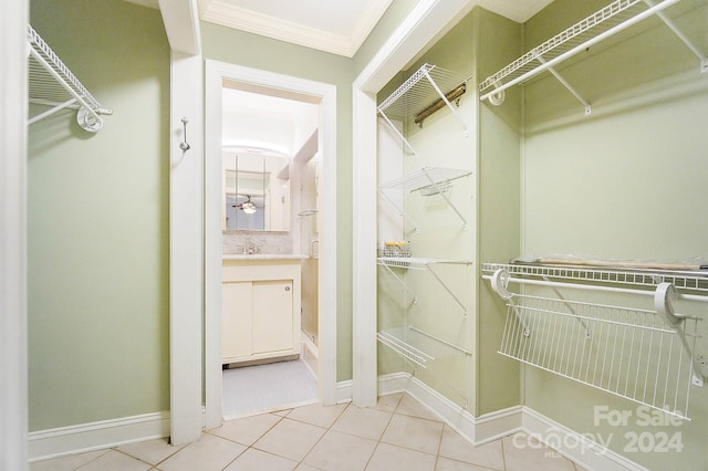 spacious closet featuring light tile patterned floors