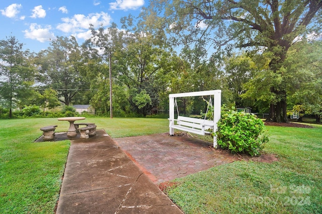 view of home's community with a lawn