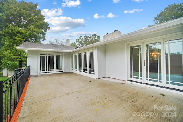 rear view of property featuring a patio