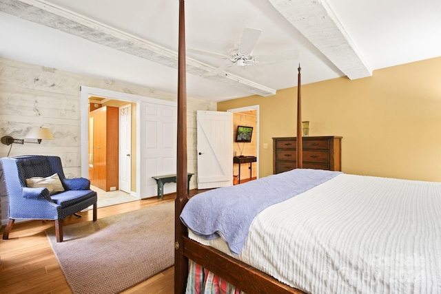 bedroom with ceiling fan and hardwood / wood-style floors