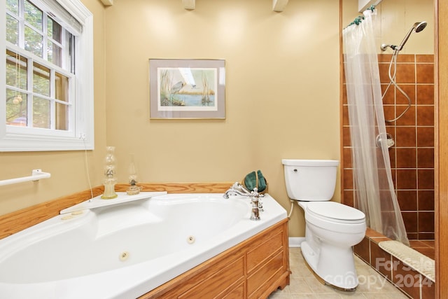 bathroom with toilet, tile patterned floors, and separate shower and tub