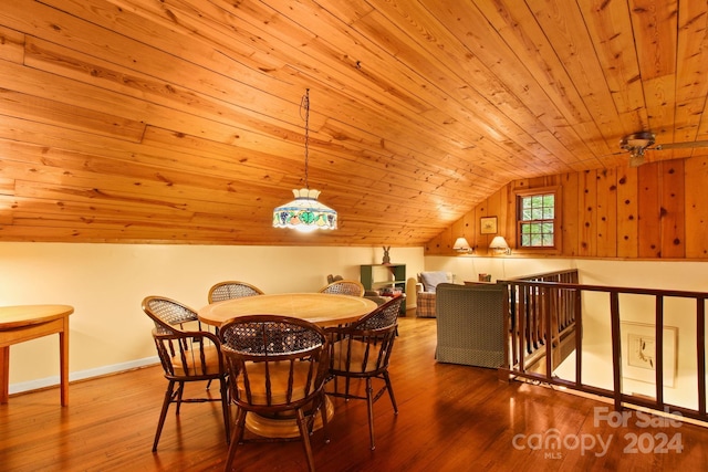 dining room featuring light hardwood / wood-style floors, lofted ceiling, and wooden ceiling