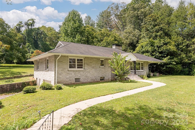 single story home with a porch and a front yard