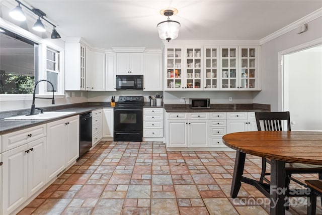 kitchen featuring pendant lighting, sink, white cabinetry, black appliances, and ornamental molding