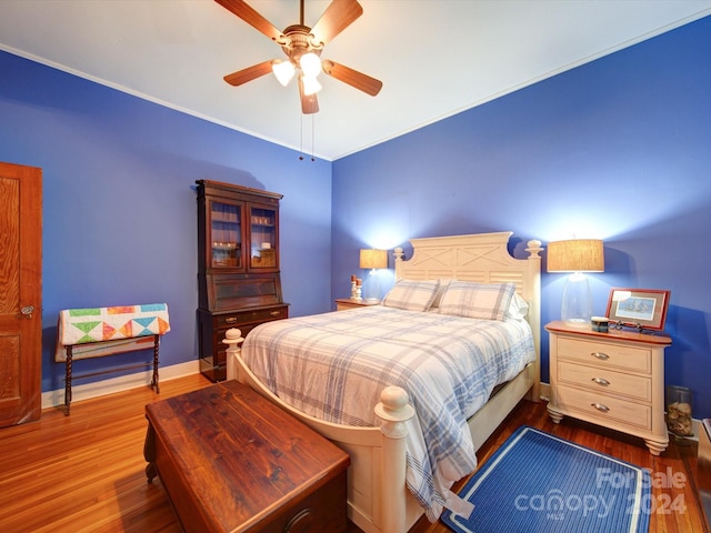 bedroom featuring ceiling fan and hardwood / wood-style flooring