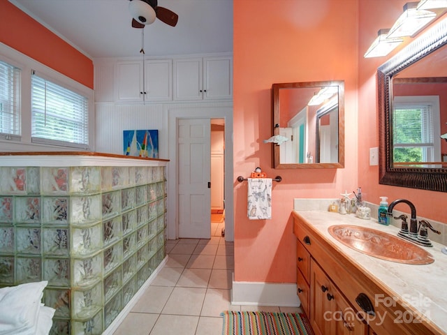 bathroom with ceiling fan, vanity, and tile patterned flooring