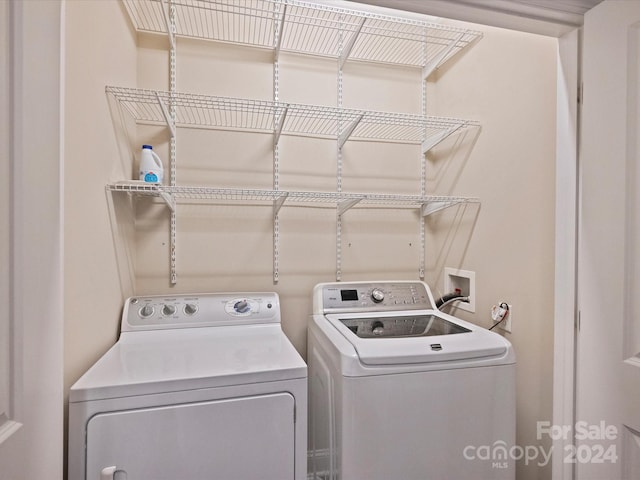 laundry room with washer and clothes dryer