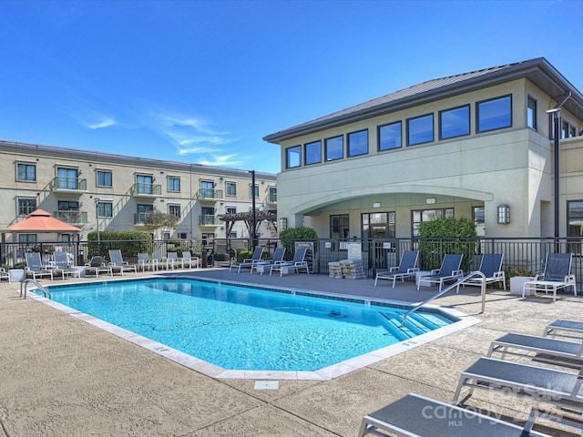 view of swimming pool featuring a patio