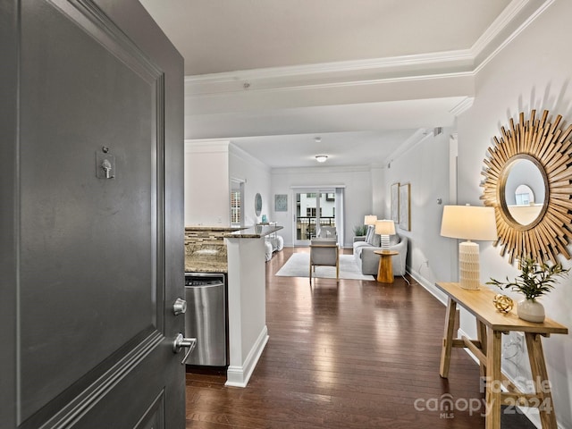 corridor with dark hardwood / wood-style flooring and ornamental molding