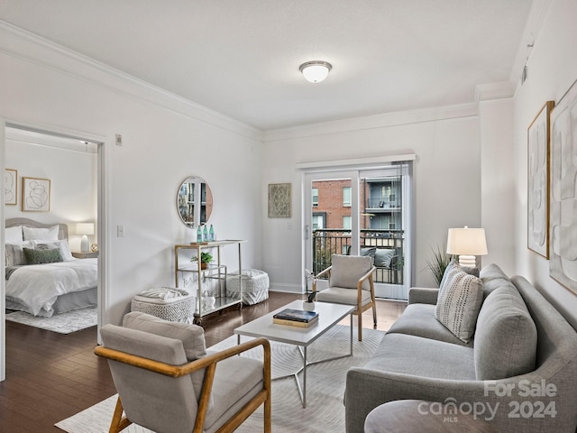 living room featuring ornamental molding and dark wood-type flooring