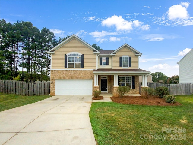 view of front facade featuring a front lawn and a garage