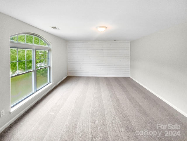 empty room featuring carpet flooring