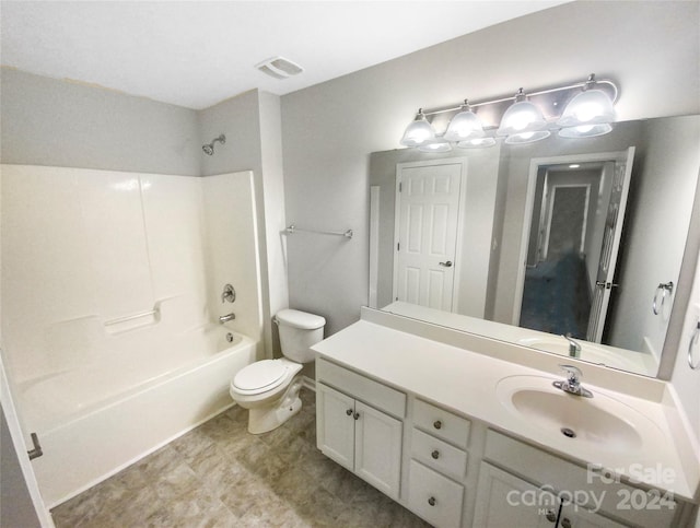 full bathroom featuring  shower combination, vanity, and toilet