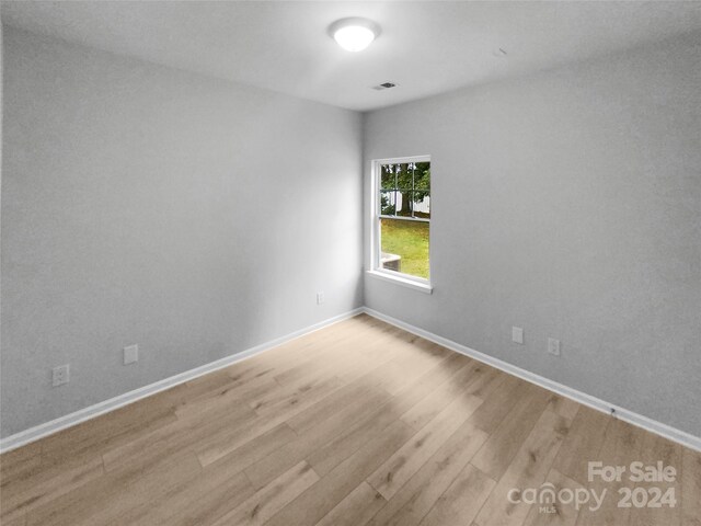 empty room with light hardwood / wood-style floors