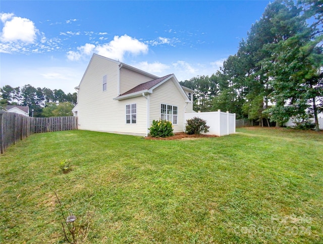 view of property exterior featuring a yard