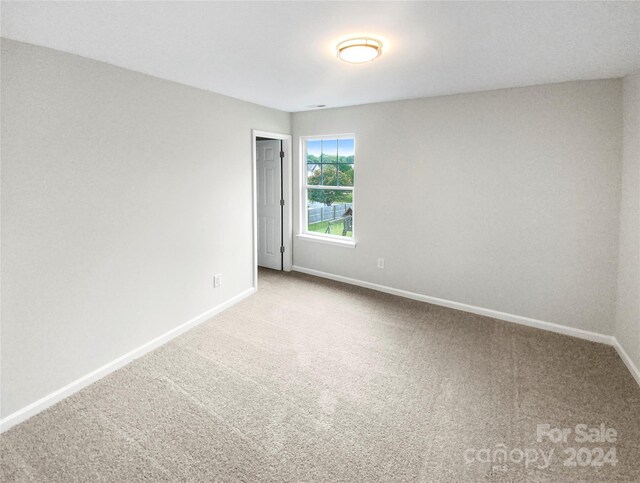 unfurnished room featuring carpet flooring