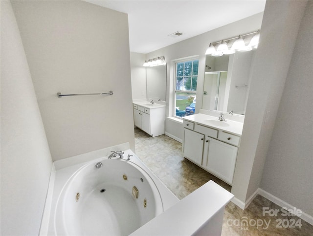 bathroom with vanity and plus walk in shower