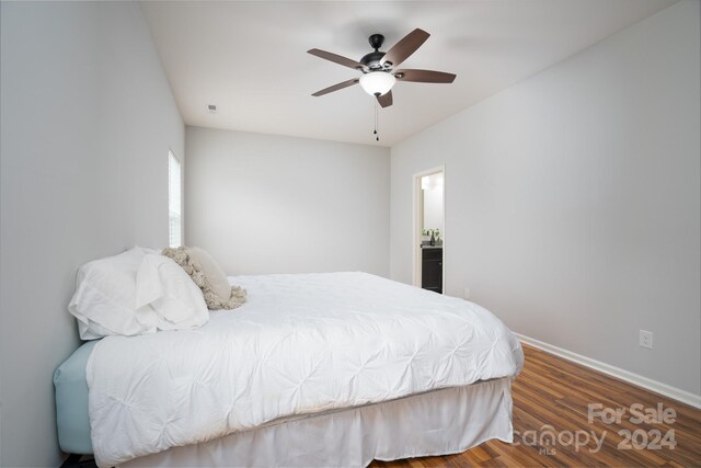 bedroom featuring ceiling fan and dark hardwood / wood-style flooring