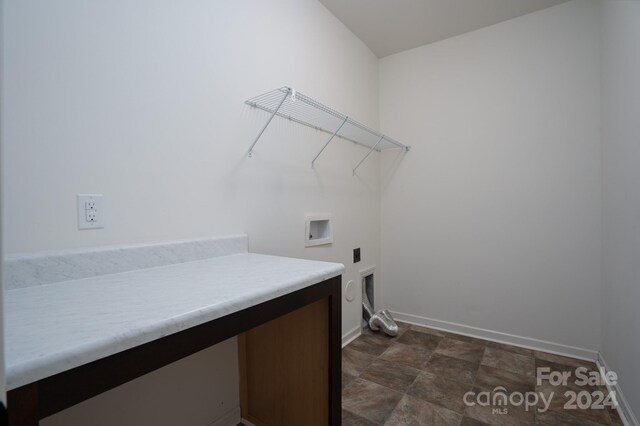 laundry room with hookup for a washing machine and hookup for an electric dryer