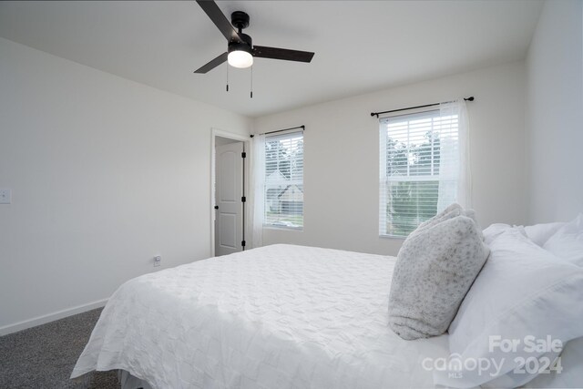 carpeted bedroom featuring ceiling fan