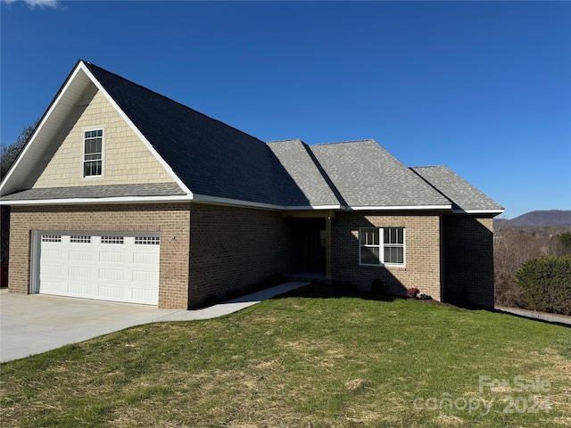 view of front facade featuring a garage and a front lawn