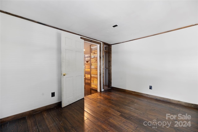 spare room featuring dark hardwood / wood-style floors