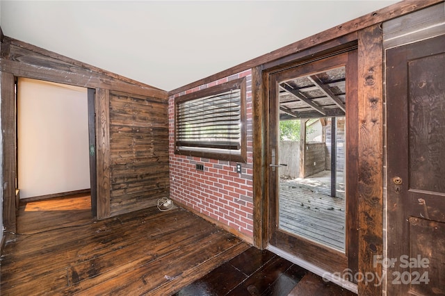 interior space featuring vaulted ceiling and hardwood / wood-style floors