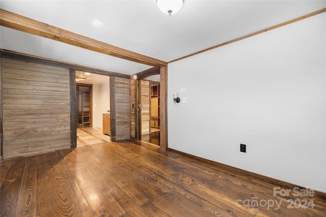 unfurnished room with hardwood / wood-style floors