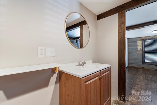 bathroom featuring hardwood / wood-style floors and vanity