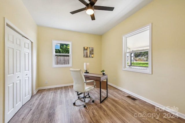 office featuring light hardwood / wood-style floors and ceiling fan